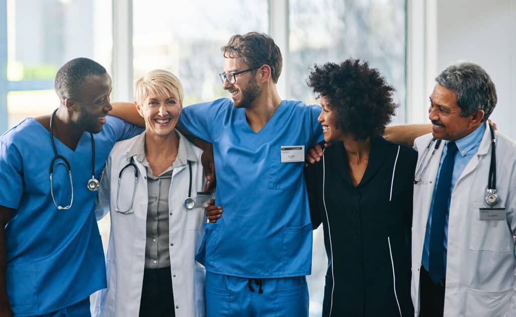 Portrait of a team of doctors standing together in a hospital